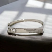 Close up of Modern X-Cross Triple Stripe Kada 925 Silver