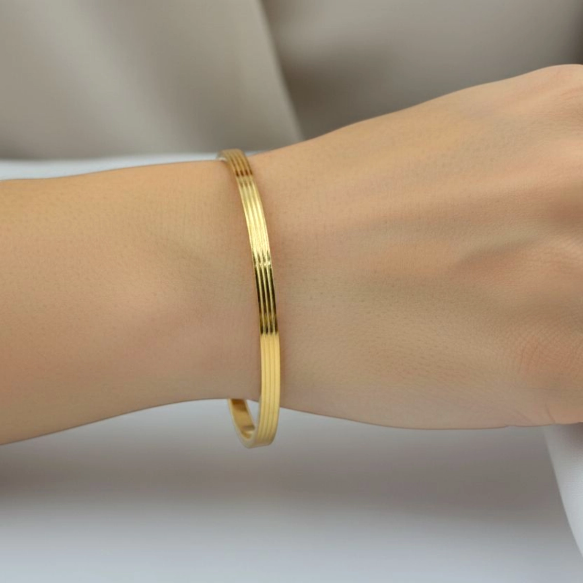 Classic Mixed Texture Gold Bangles – 925 Silver 3 Model wearing Classic Mixed Texture Gold Bangles 925 Silver